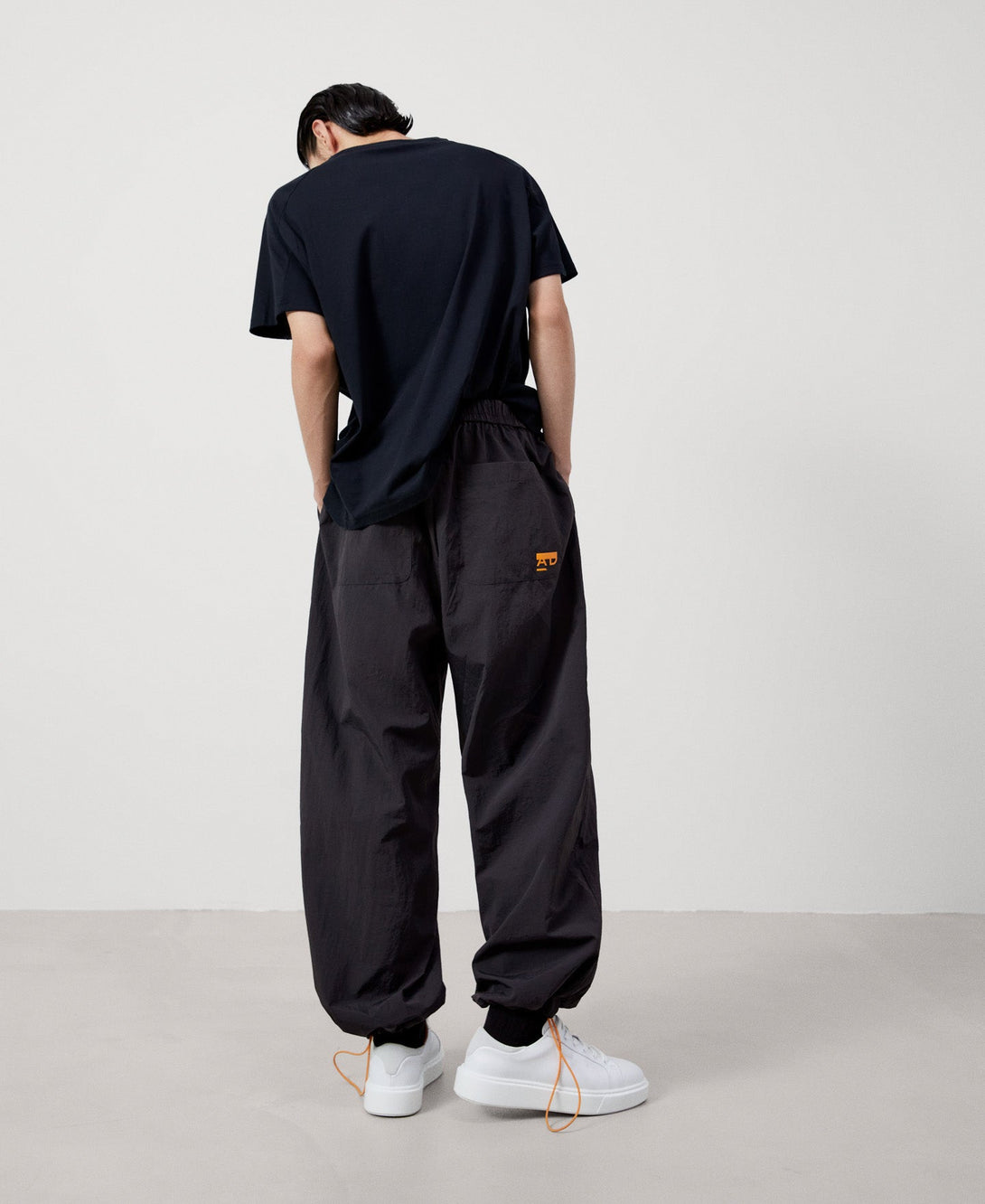 Men Trousers | Black Nylon Baggy Trousers by Spanish designer Adolfo Dominguez